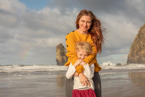 Claire Hempel with her daughter on the beach in Oregon.