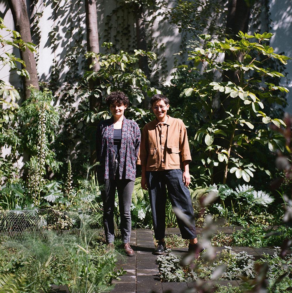 Susana Rojas Saviñón and Hortense Blanchard standing side-by-side in front of greenery