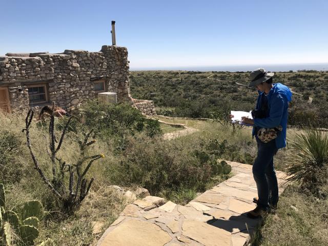 A student looking at a historic building