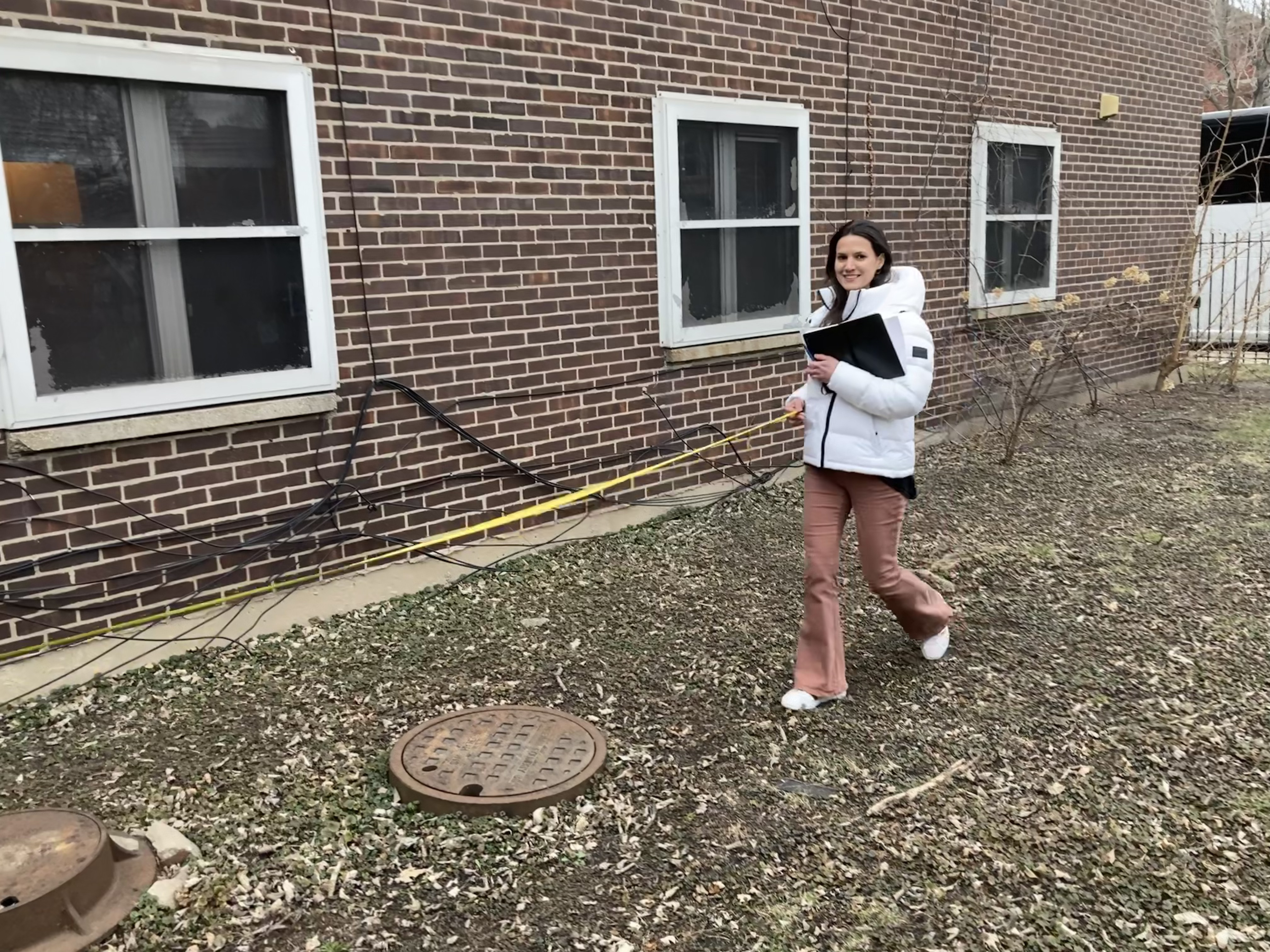 Student with a measuring tape at the site in Chicago