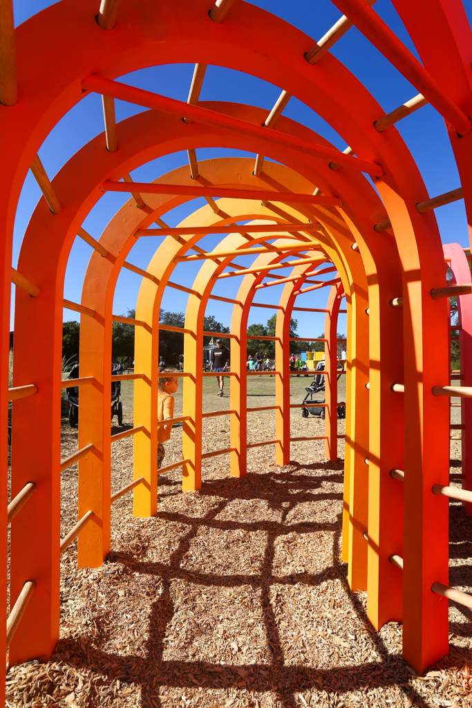 Another view looking through the arches of Monkey Bar Fort this time in shades or orange and yellow.