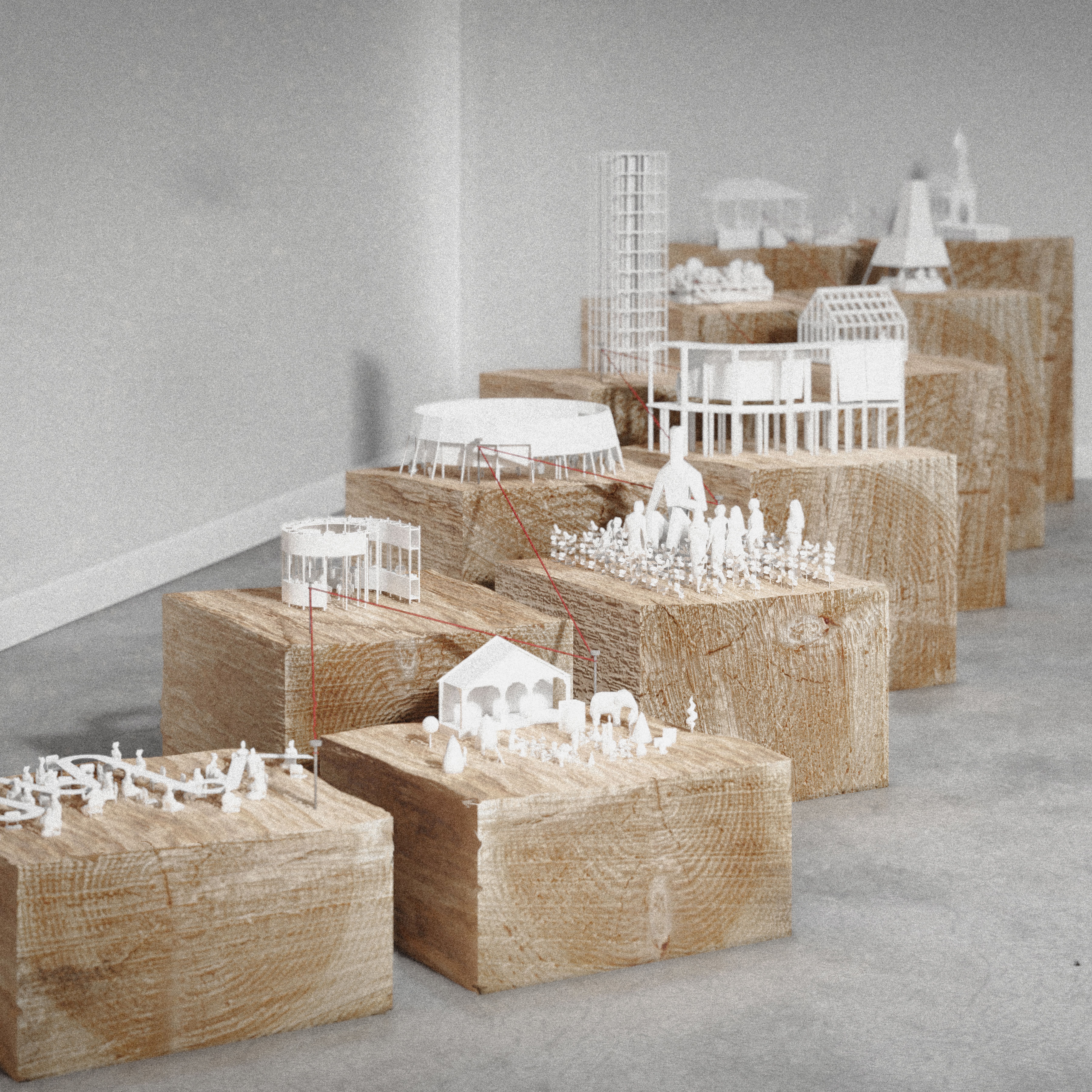 White architectural models on display on wood blocks.