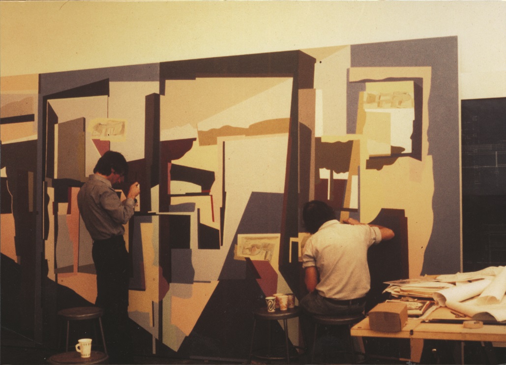 Students in the 1970s painting a mural in studio