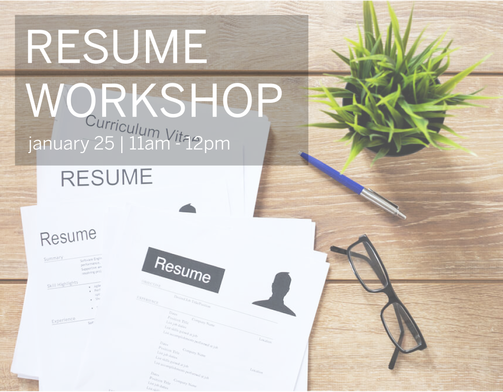 Overhead view of a table with resumes, a pen and black glasses with the words "Rsume Workshop" laid on top