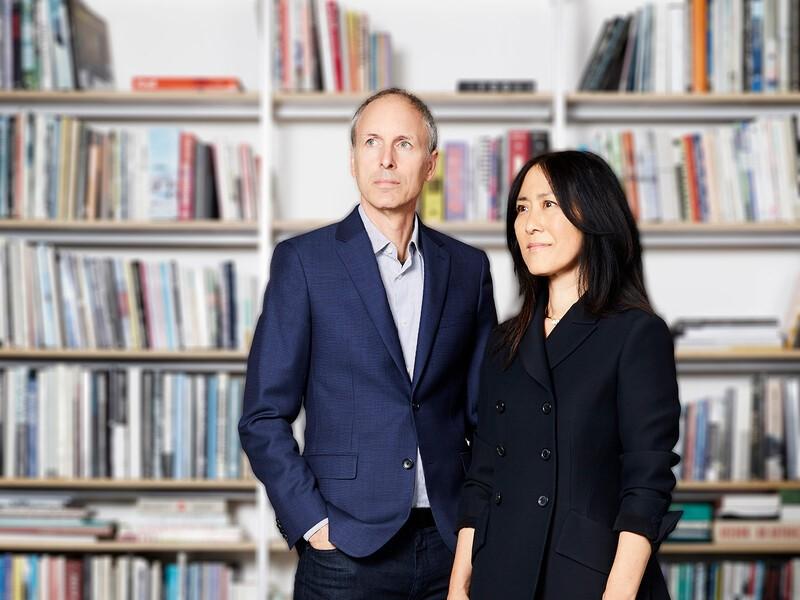 Lisa Iwamoto and Craig Scott standing in front of a wall of books
