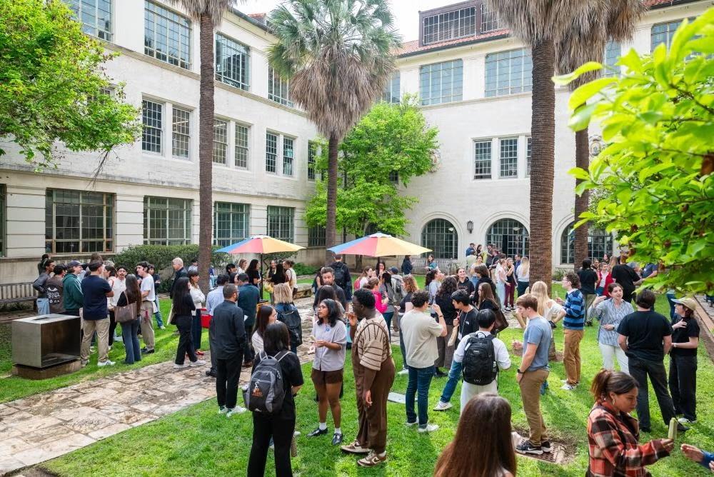 students in the couryard chatting with each other 