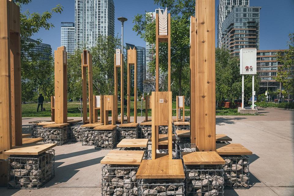 View of Multispecies Lounge in front of skyscrapers in Toronto