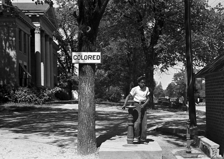 Where bodies met water, Jim Crow drew a sharp color line. Halifax County Courthouse, North Carolina, photo 1938 by Charles Christopher Crittenden/ Farm Security Administration/ Wikimedia Commons.