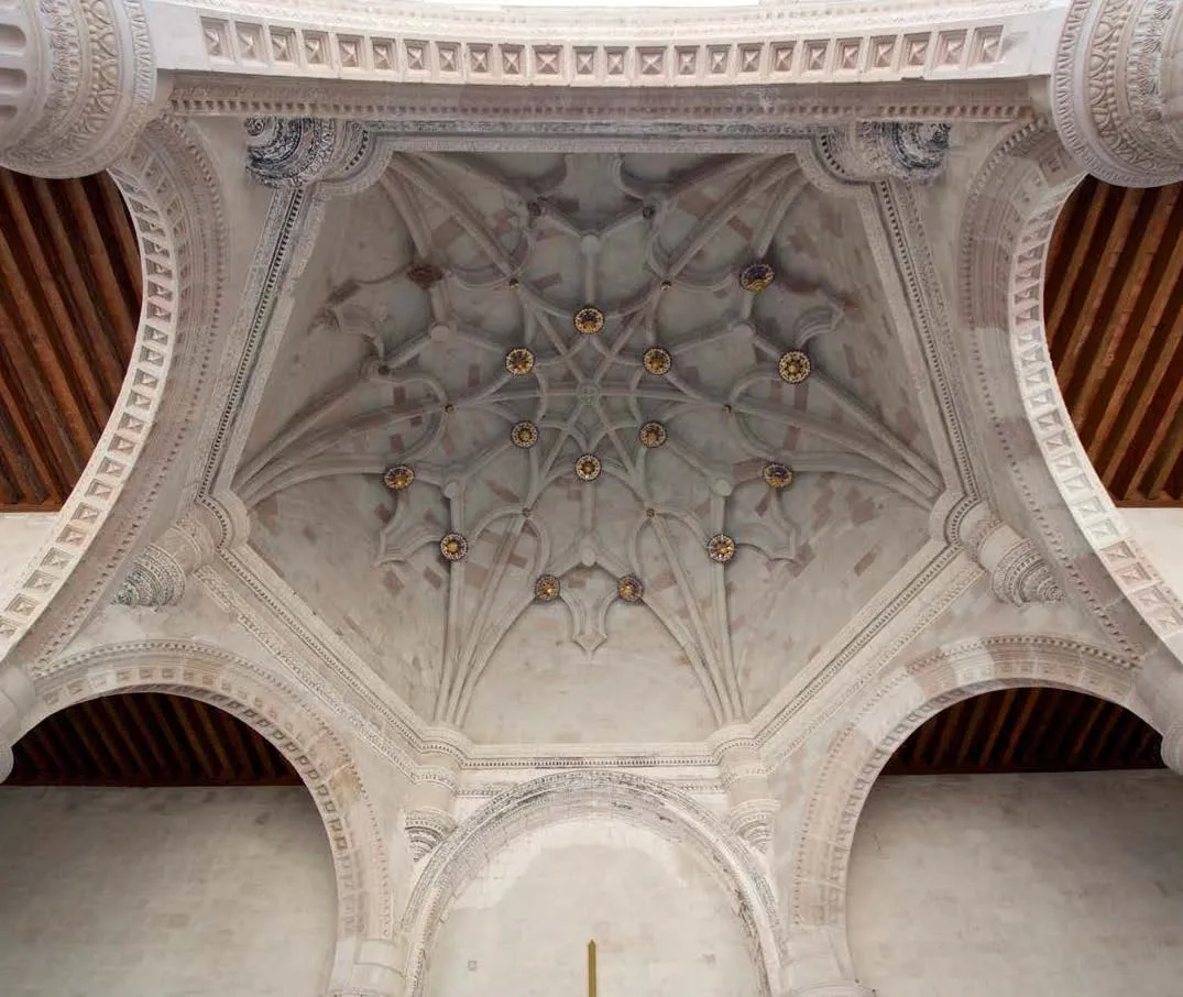 Upward facing shot of the interior of a vaulted ceiling with detailed markings