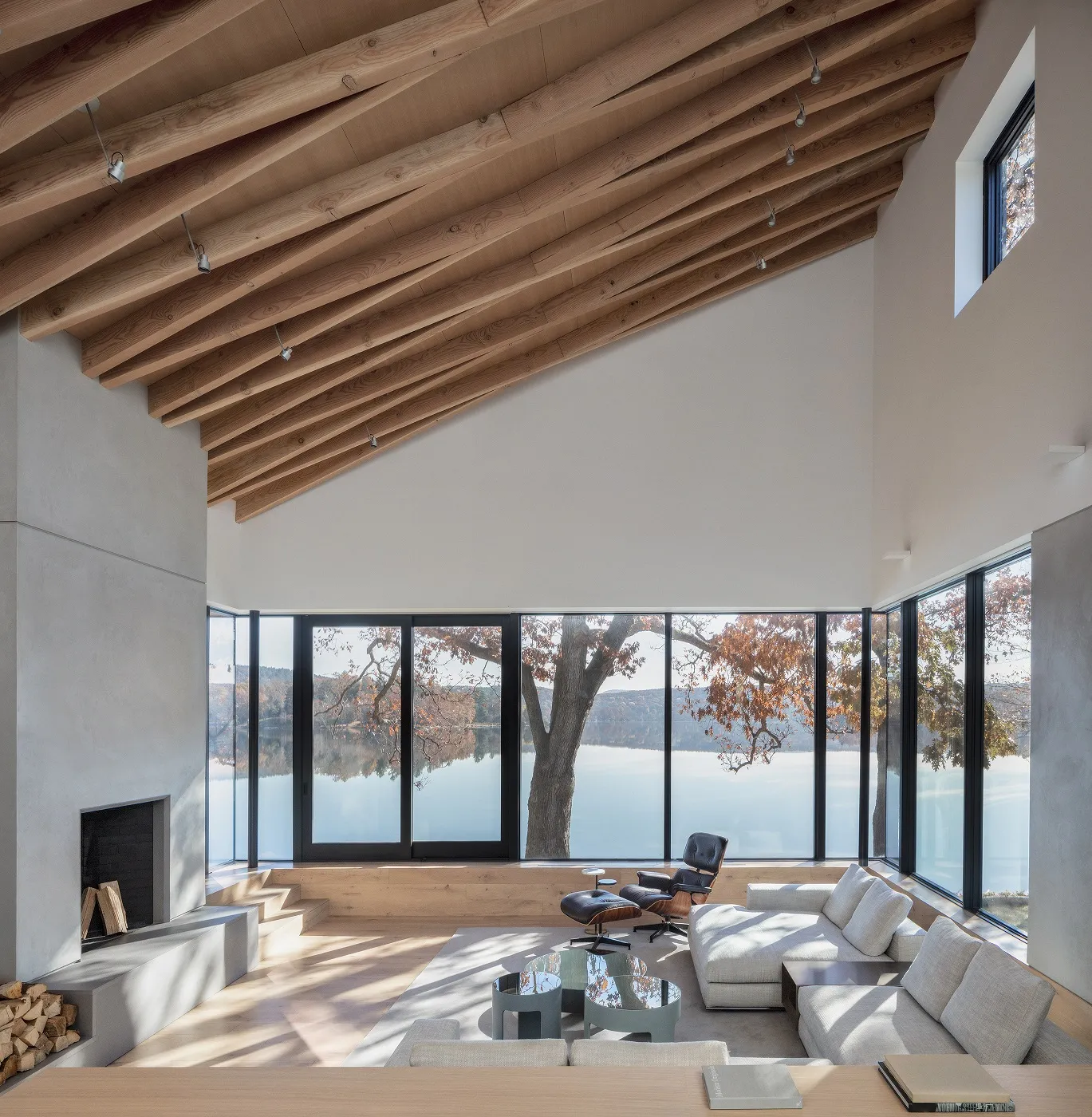 Interior of a living room with a view looking out onto calm waters