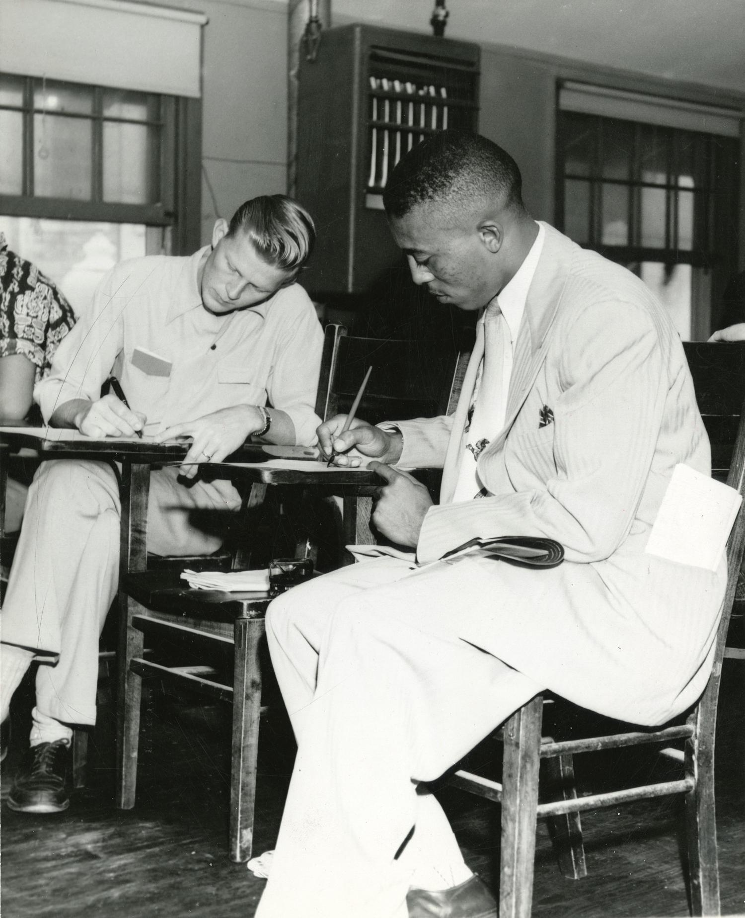 John Chase seated at a desk