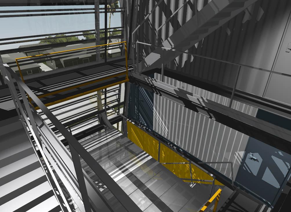 Photo of a stairwell with light filtering through windows and the rails in interesting ways