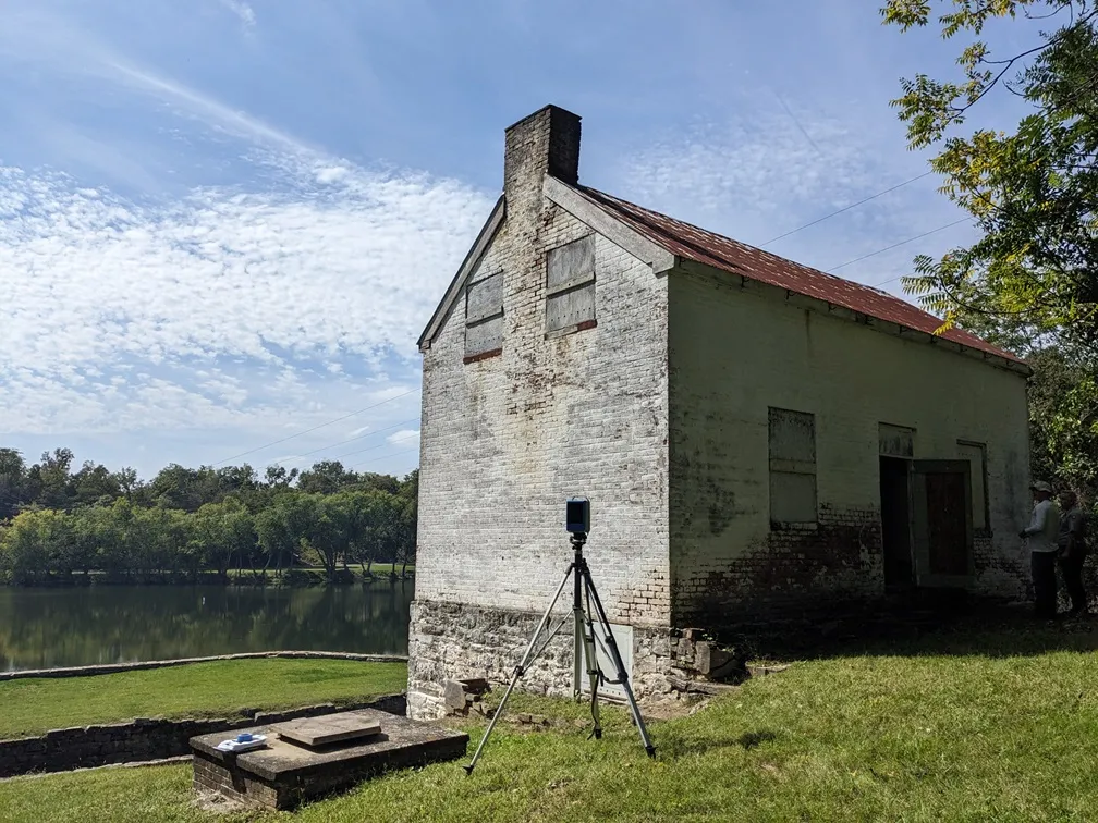 External facade of a historic lockhouse overlooking a canal
