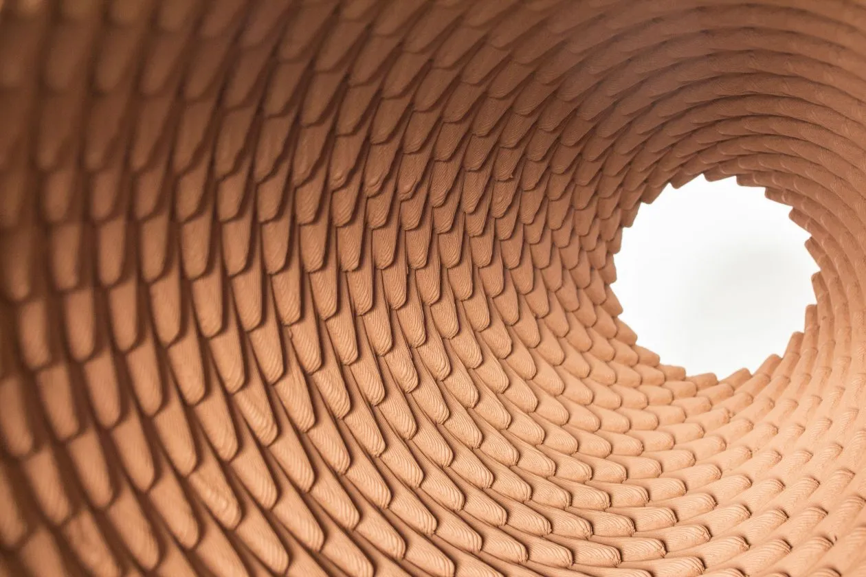 view through a textured terracotta sculptural piece