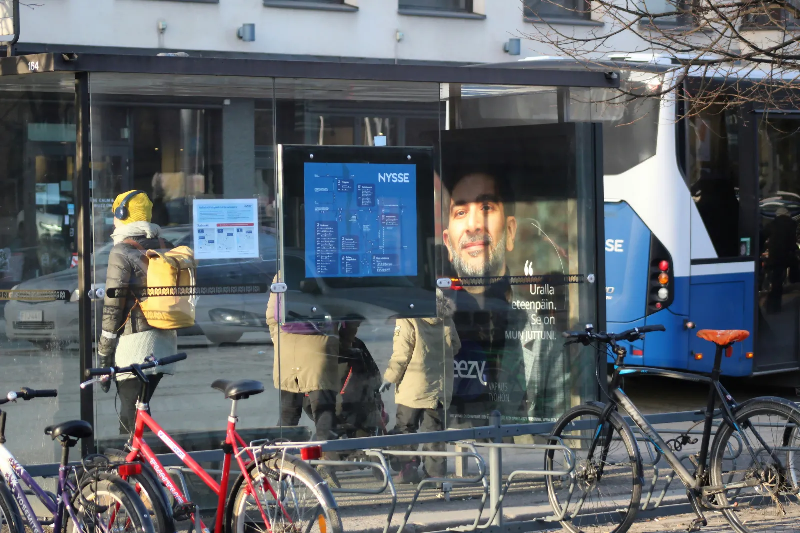 a bus stop with bike rack in front