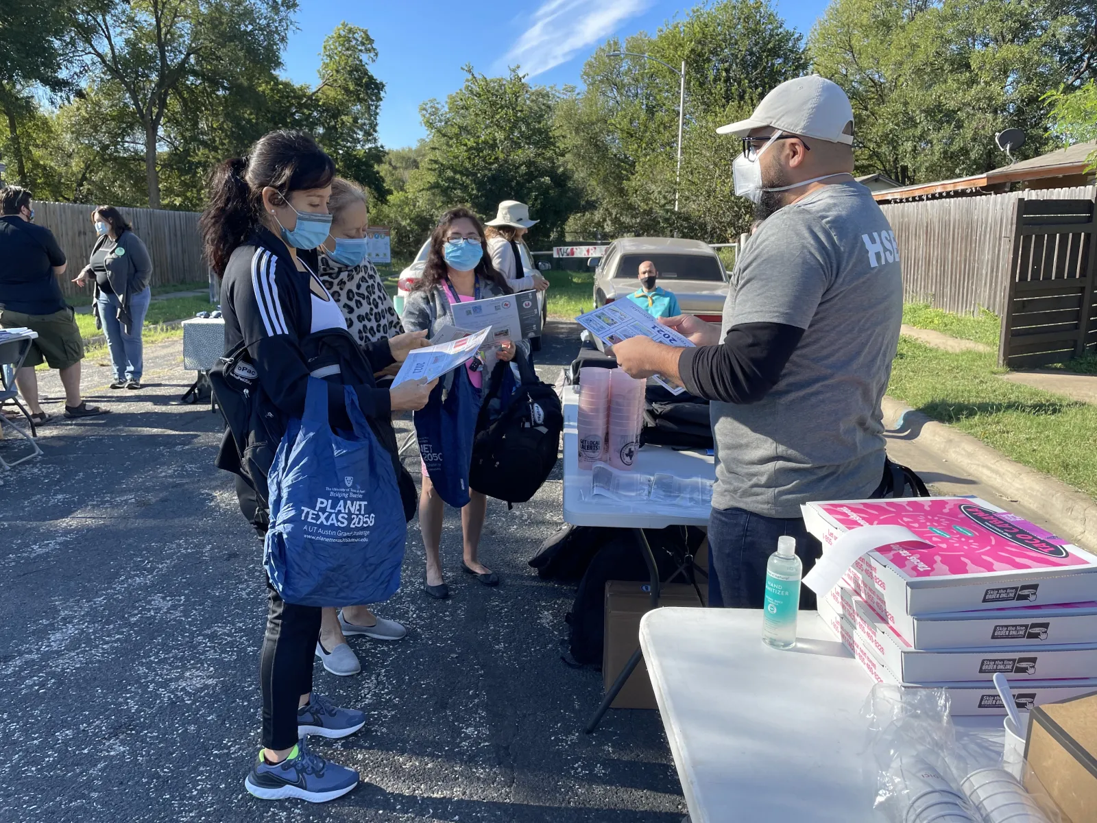Climate Navigators Kick-off Masked volunteers gather outside of of a park