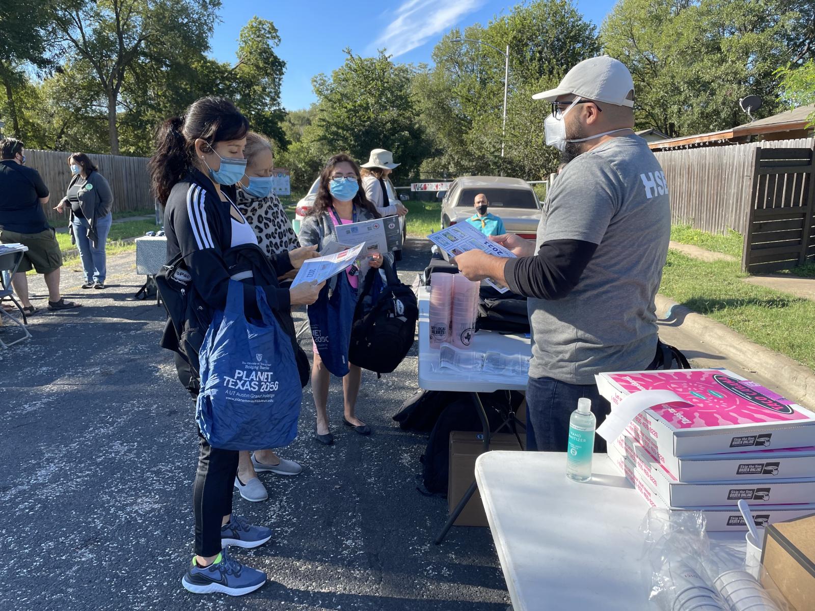 Climate Navigators Kick-off Masked volunteers gather outside of of a park