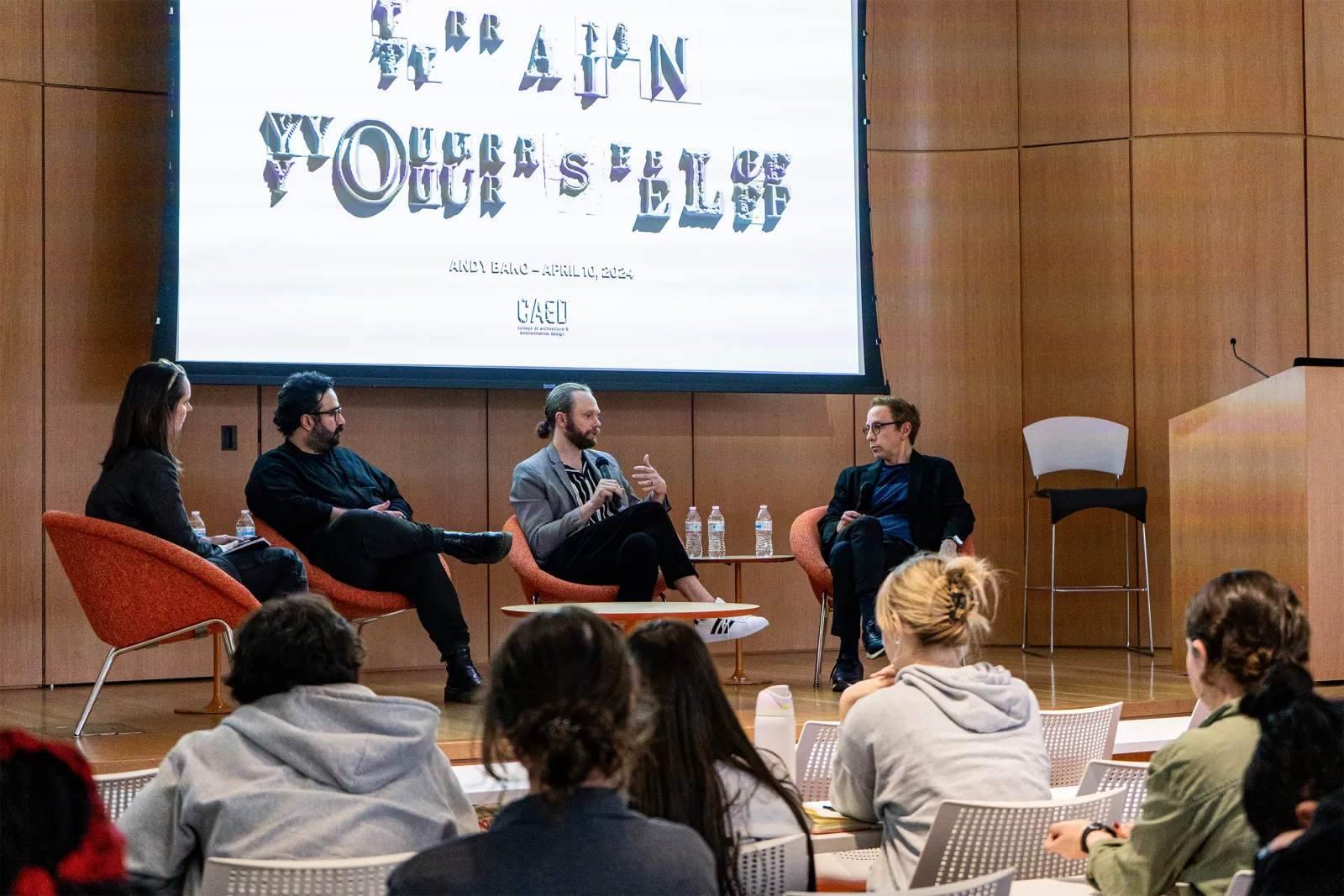 Andy Bako in panel discussion with three other people