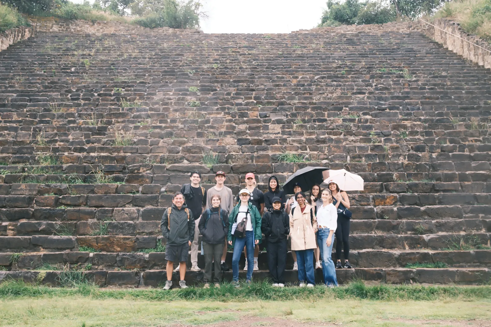 Studio class poses in front of Oaxacan ruins