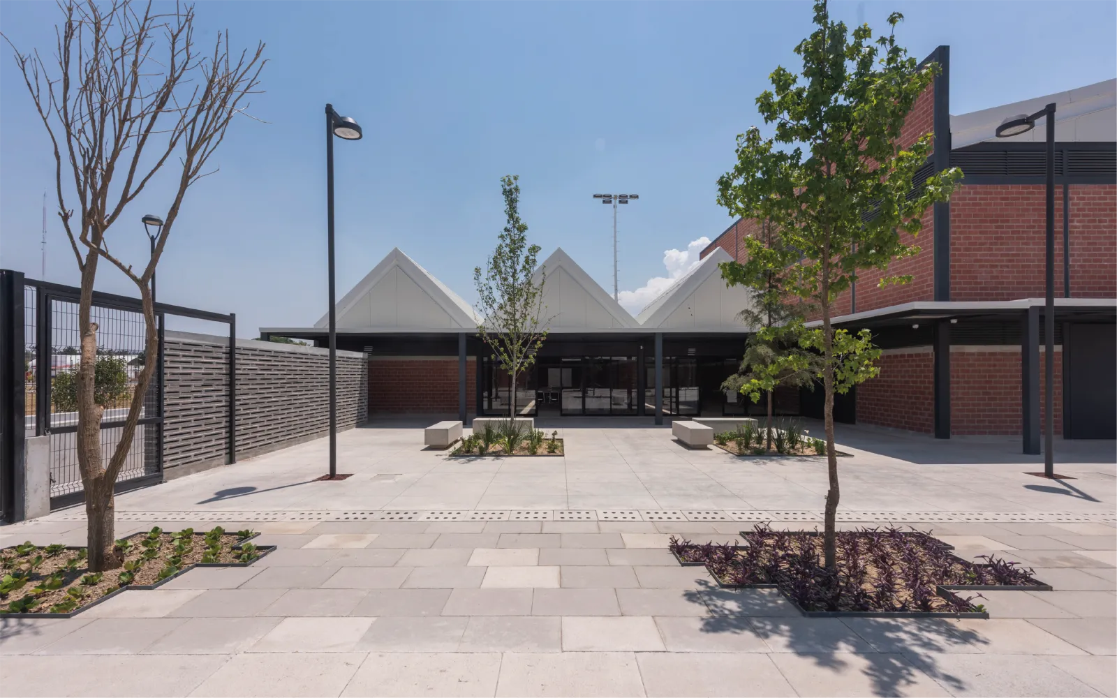 Courtyard outside of a windowed and brick building