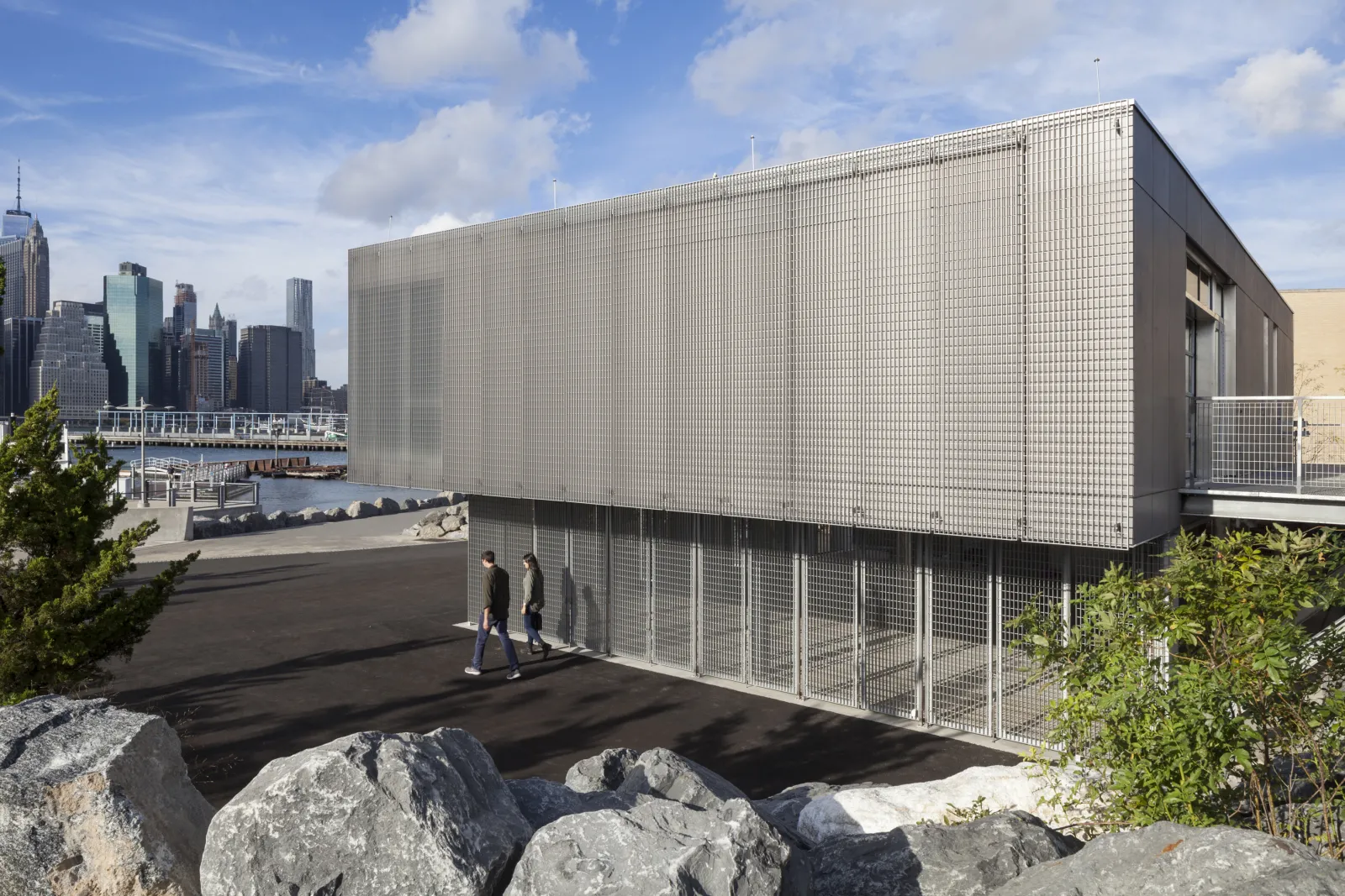 Exterior image of the Brooklyn Bridge Park Boathouse, a rectangular gray steel building