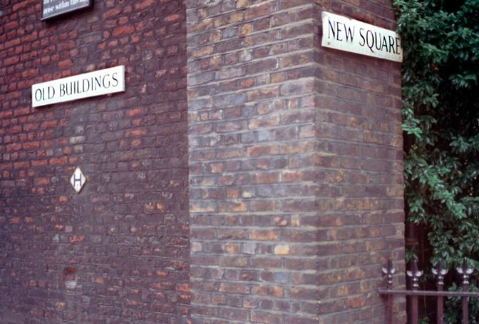 old brick building with signs