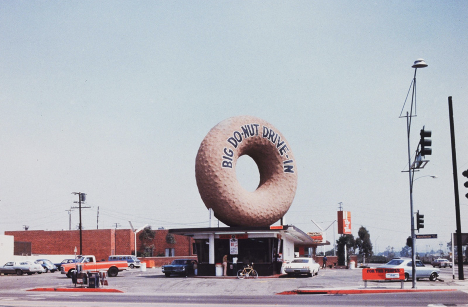 gas station with a giant donut on top