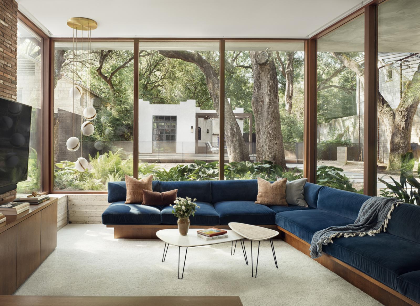 Pecan Grove Residence Pecan Grove Residence interior living room with a couch and large windows