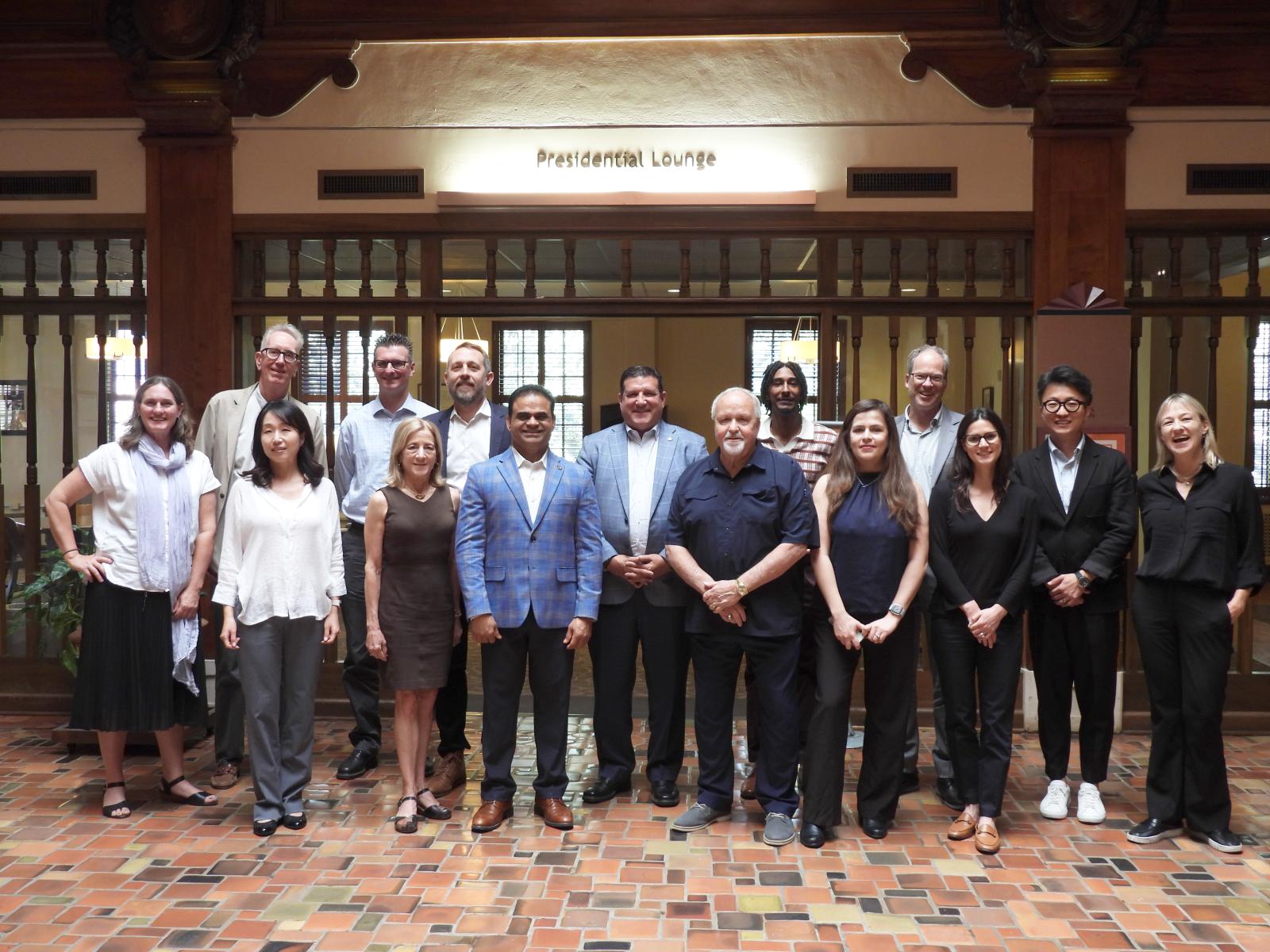 Participants in the Texas Triangle County Judges' Planning and Design forum Judges and academics standing in the Texas Union