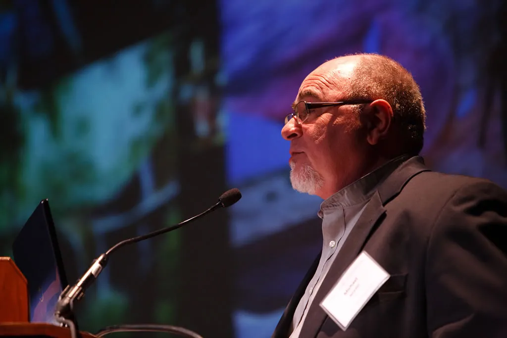 A man speaking at a podium