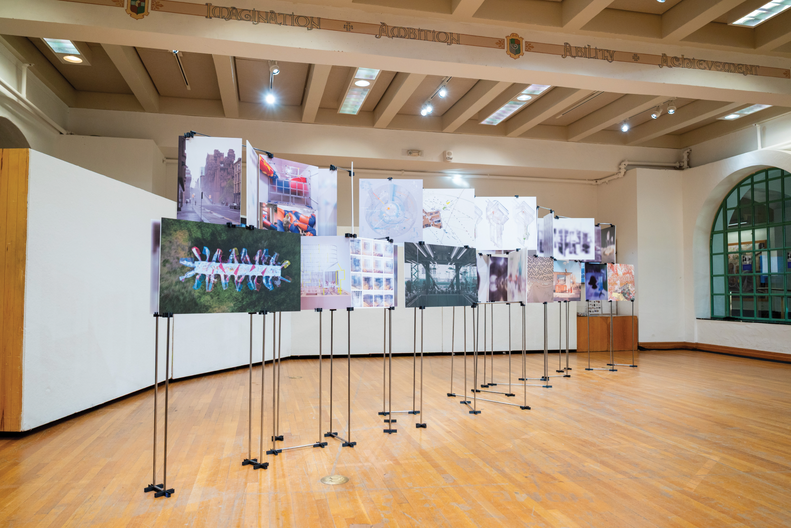 Exhibition from Interior Provocations Weather Symposium with images held on a freestanding structure