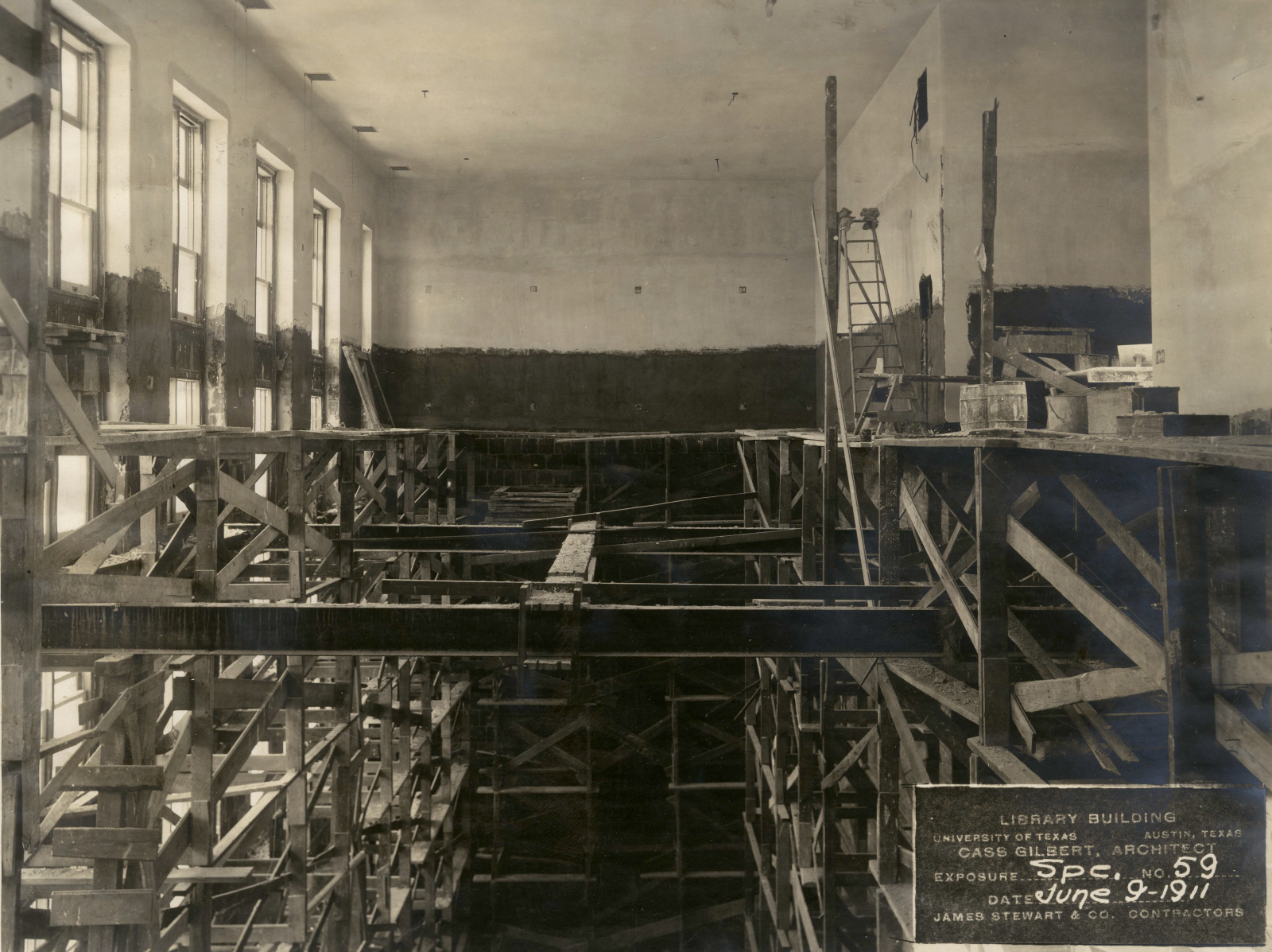 Historic photo of Battle Hall under construction in 1911 showing windows and scaffolding
