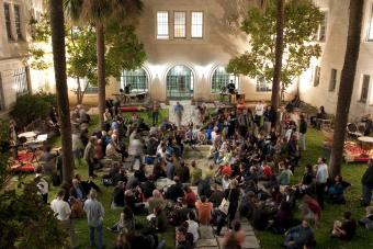 View down into a populated event within the GOL courtyard during the evening