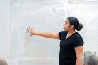 A female student presents her architecture project