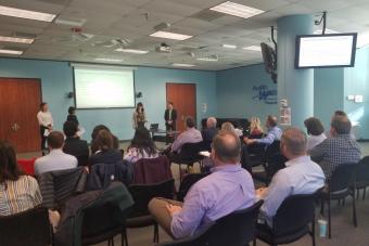 Students presenting to Austin Water executives