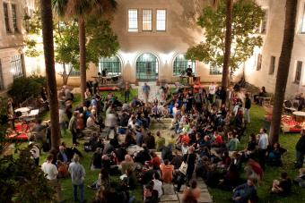 Students gathering in the Goldsmith Courtyard at night