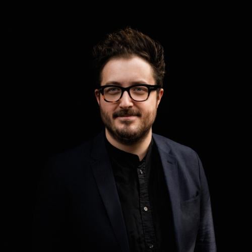 Photo of Owen Duross against a black background 