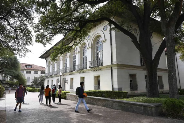 Students walking on campus outside Battle Hall