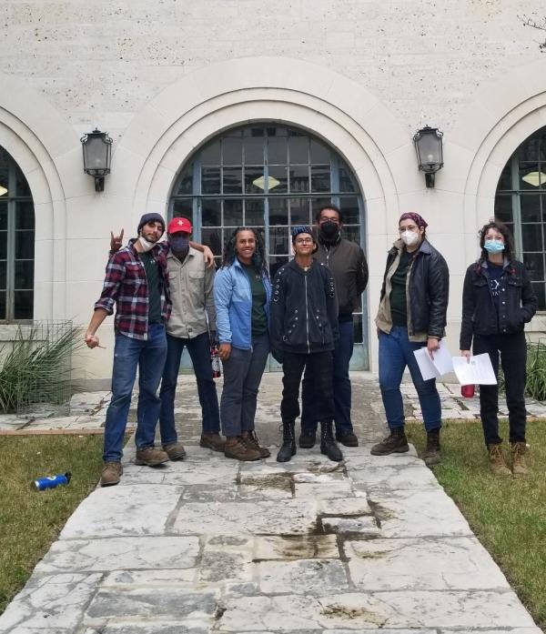 ACCC American YouthWorks participants pose in the Goldsmith Courtyard wearing masks