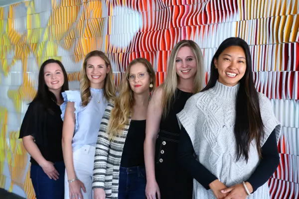 Group photo of UTSOA's Metropolis Future 100 in front of the ODNA wall