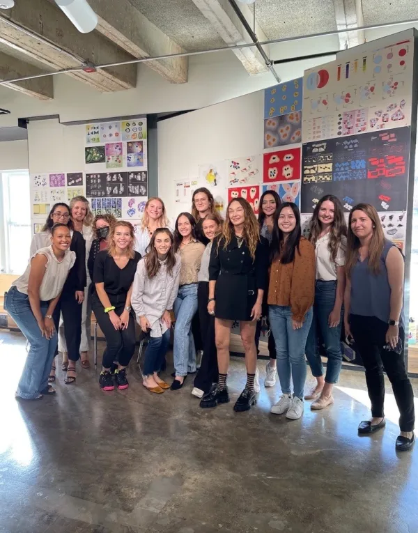 Students pose with Kelly Wearstler on the 5th floor of the West Mall Building