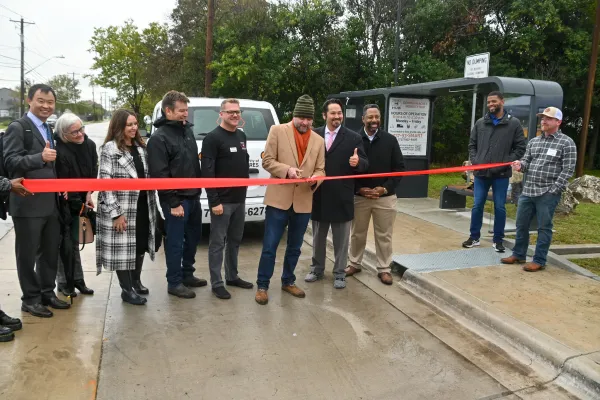 Junfeng Jiao and Dean Michelle Addington at the ribbon cutting event for the Georgian Acres Smart Mobility Hub