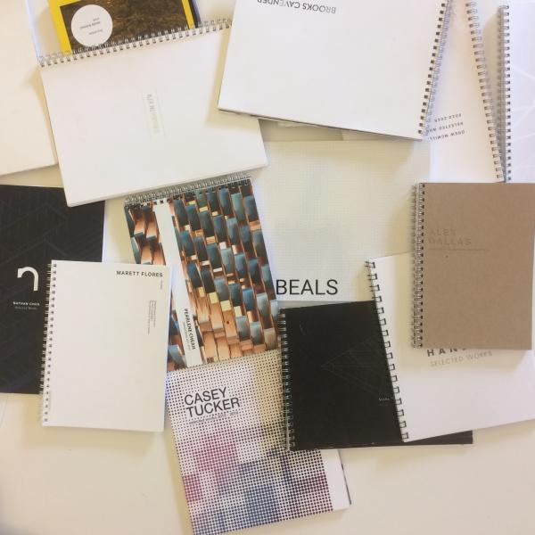 Student portfolios laid out on a table