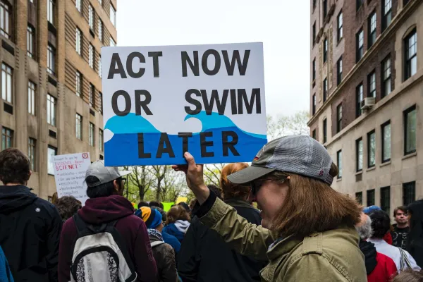 Protester holding up a sign