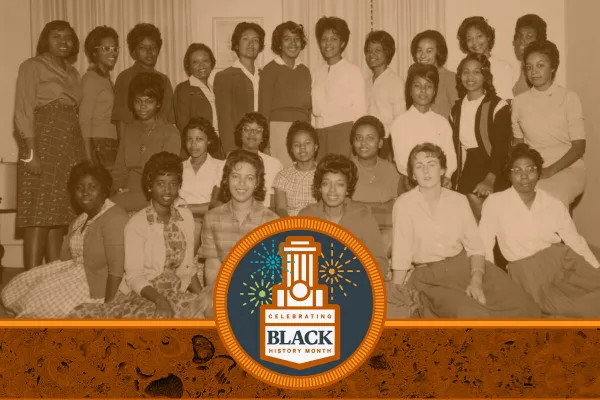 Rows of Black students smiling at the camera in a sepia-toned image