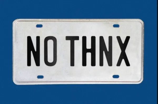 License plate that reads "No Thnx" on a blue background