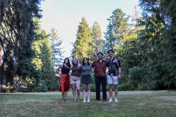 Design futures student participants standing in a grassy field