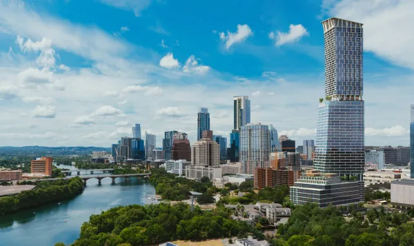 Rendering of a supertall skyscraper seen in the forefront of the image along the waterfront of Lady Bird Lake