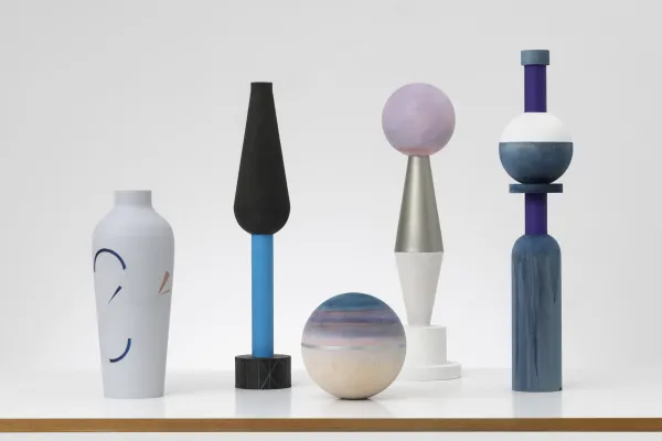 Several color geometric ceramic pieces of art by Claudia Wieser against a white backdrop