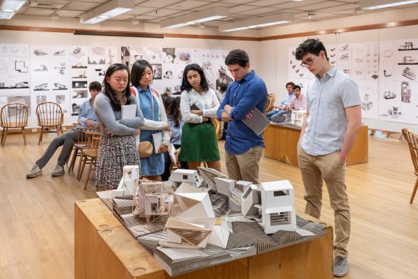Students standing around a final review